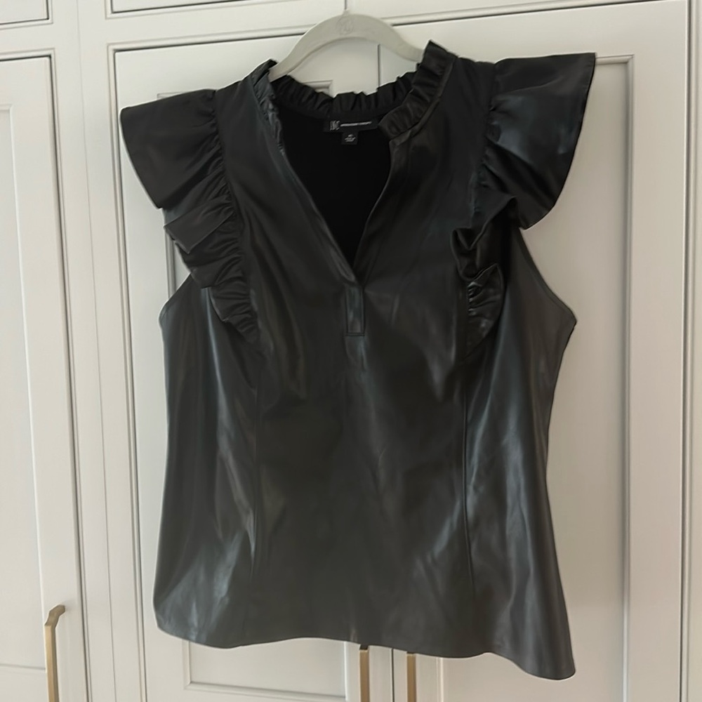 Black pleather front, Spandex back, ruffle sleeves in XL.